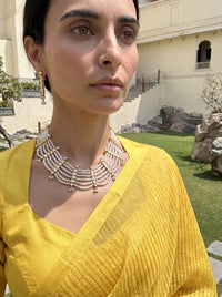 Jadau Kundan haar with six pearl strands and matching drop earrings