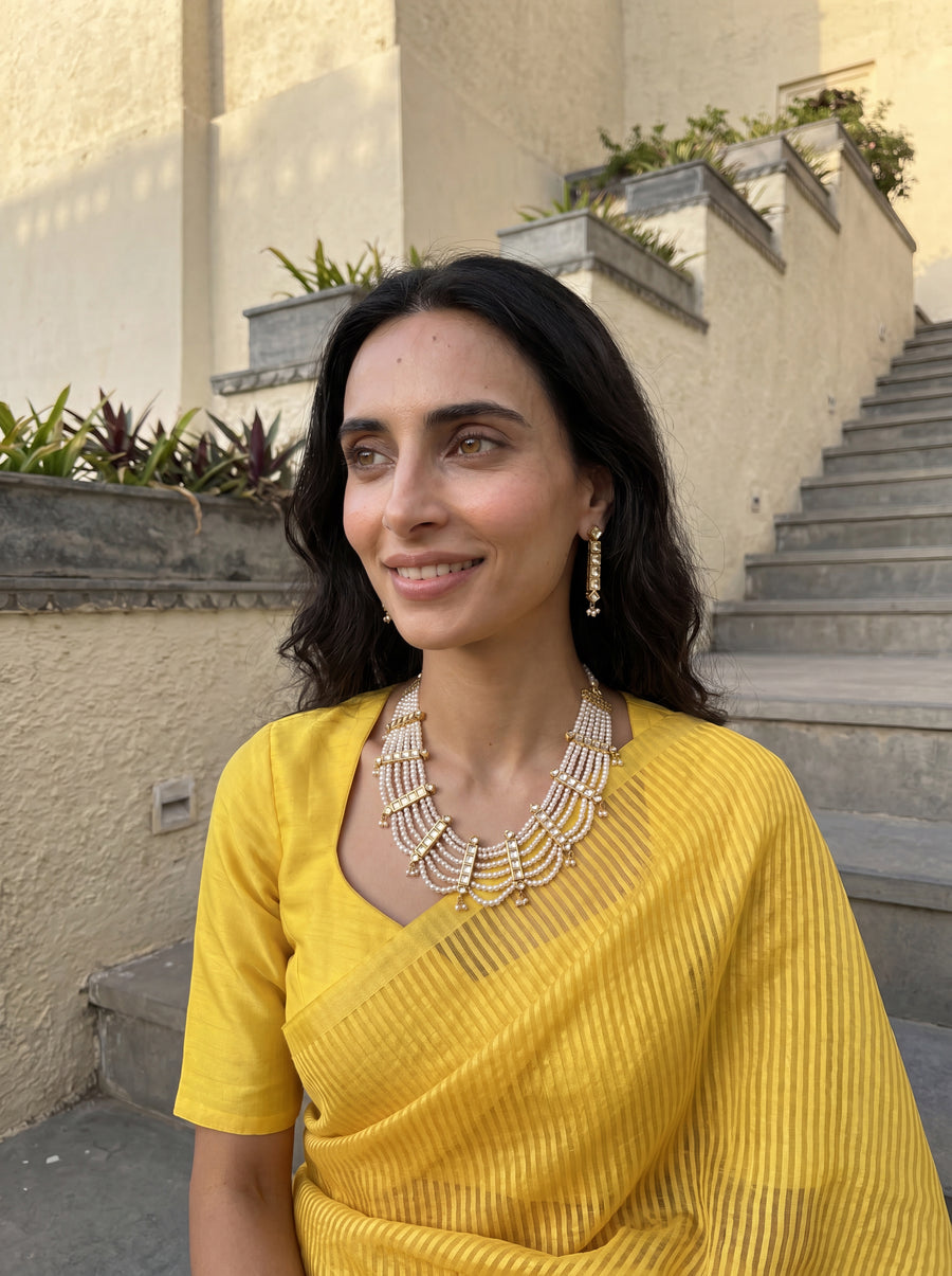 Jadau Kundan haar with six pearl strands and matching drop earrings