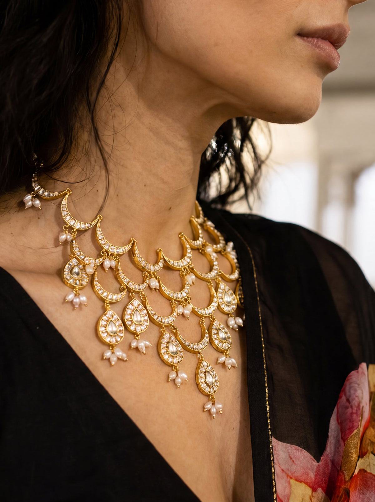 Kundan Polki bib necklace with cascading wave motifs and pearl drop clusters