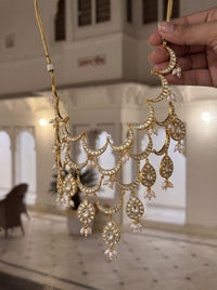 Kundan Polki bib necklace with cascading wave motifs and pearl drop clusters